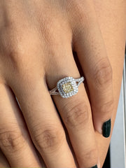 Natural Cushion Shaped Engagement Ring in 18K White Gold. Natural Diamonds with a Fancy Yellow Color center stone and VS Clarity.